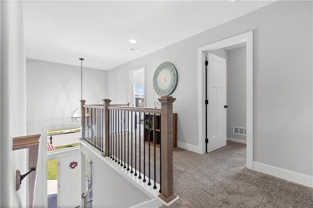 hallway featuring carpet floors