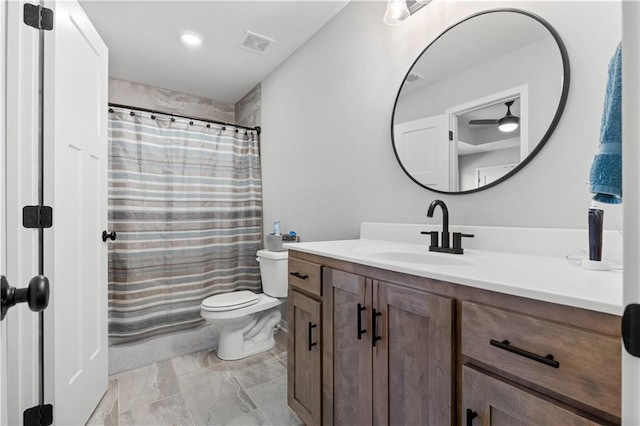 bathroom with a shower with curtain, vanity, and toilet