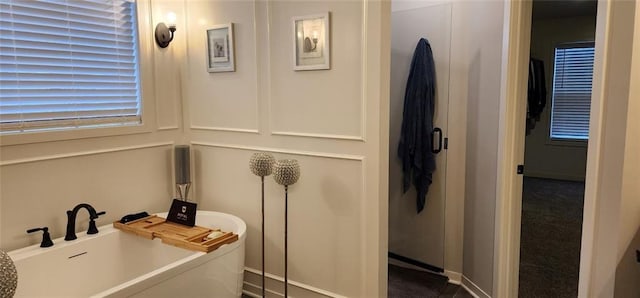 bathroom featuring a washtub