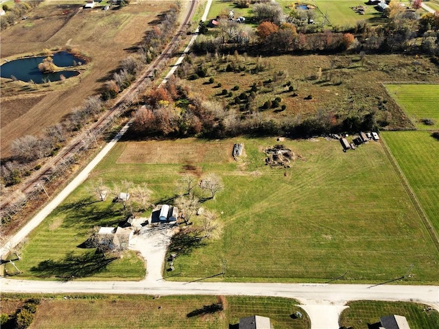 aerial view featuring a water view and a rural view