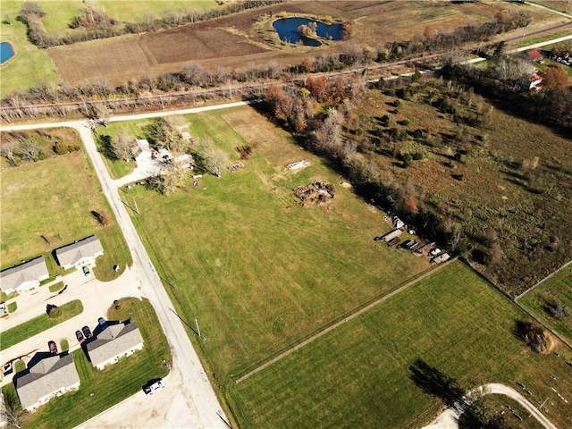 drone / aerial view with a water view and a rural view