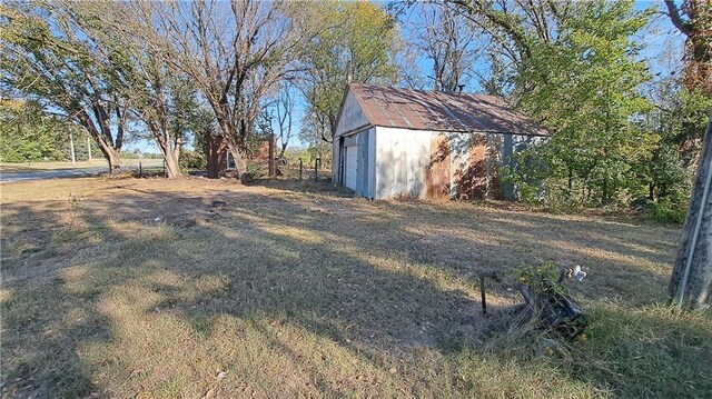 207 E 4th, Longton, KS 67352 - view of yard with an outbuilding and a garage