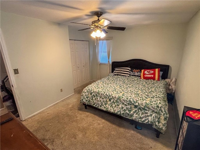 bedroom with ceiling fan, carpet floors, and a closet