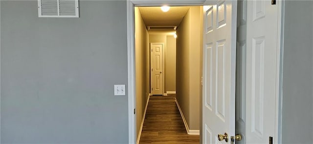 corridor featuring dark wood-type flooring