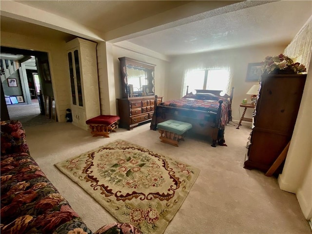 bedroom with light colored carpet