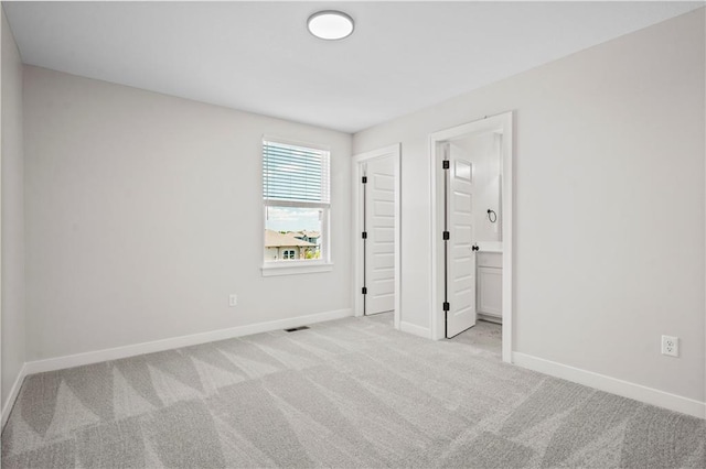 1933 SW Merryman Dr, Lees Summit, MO 64082 - unfurnished bedroom with carpet, baseboards, and ensuite bath