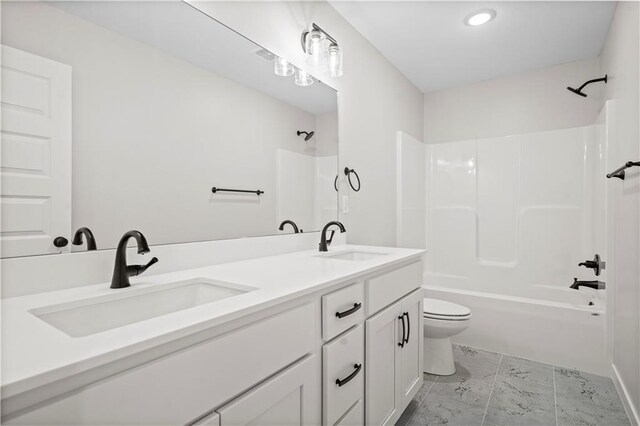 1933 SW Merryman Dr, Lees Summit, MO 64082 - bathroom featuring toilet, double vanity, and shower / washtub combination