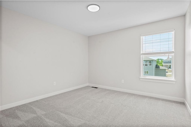 empty room featuring carpet flooring