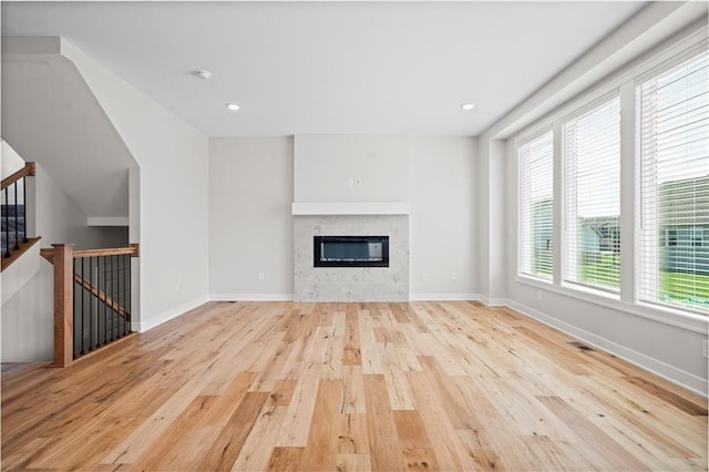 unfurnished living room featuring light hardwood / wood-style floors