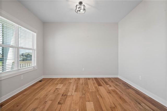 1933 SW Merryman Dr, Lees Summit, MO 64082 - unfurnished room featuring light wood-style flooring and baseboards