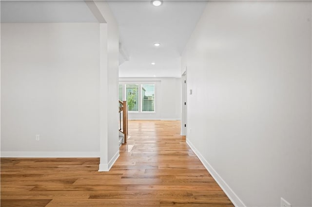 corridor with light wood-type flooring