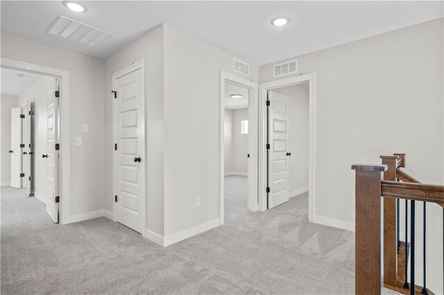 1933 SW Merryman Dr, Lees Summit, MO 64082 - hall featuring carpet, baseboards, recessed lighting, and an upstairs landing