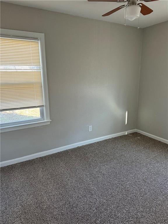 empty room featuring ceiling fan and carpet floors