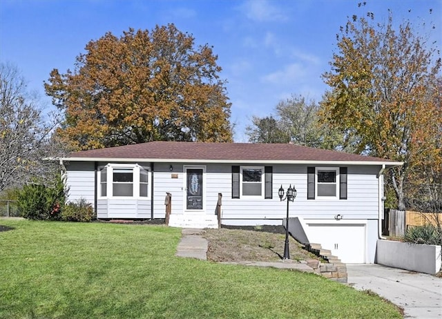 ranch-style home with a garage and a front lawn