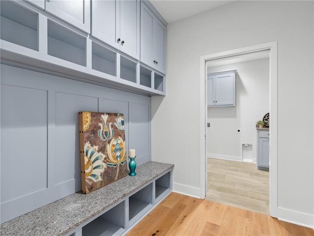 mudroom with light hardwood / wood-style floors