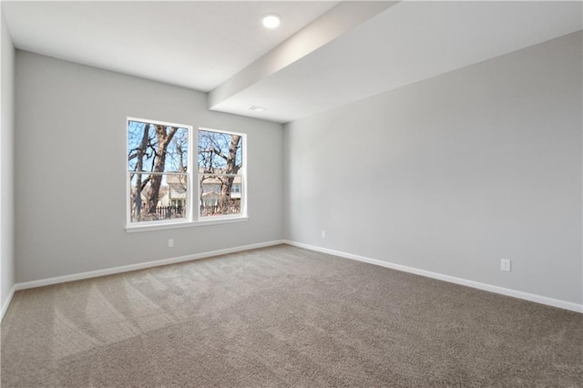 unfurnished room featuring carpet