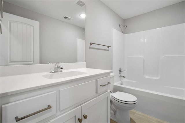 full bathroom with vanity, toilet, wood-type flooring, and bathing tub / shower combination