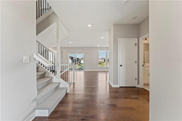 entrance foyer with recessed lighting, stairway, wood finished floors, and baseboards