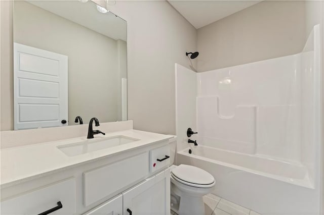 bathroom featuring toilet, tile patterned flooring, washtub / shower combination, and vanity