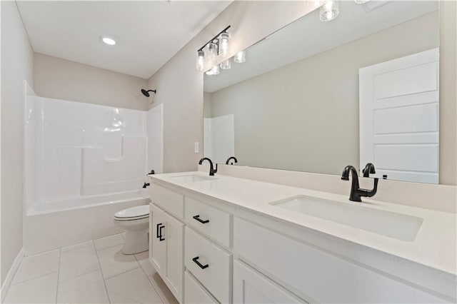 full bathroom featuring toilet, double vanity, a sink, and tub / shower combination