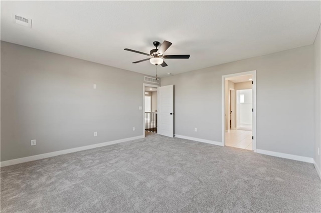 unfurnished bedroom with visible vents, ceiling fan, carpet floors, and baseboards