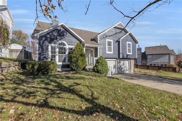 view of front of property with a front lawn and a garage