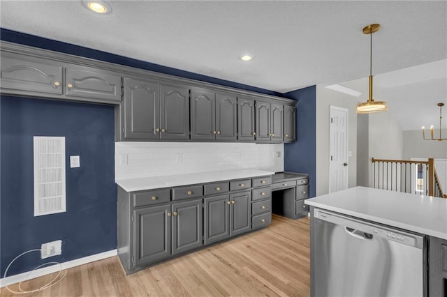 kitchen featuring dishwasher, hanging light fixtures, backsplash, gray cabinets, and light wood-type flooring