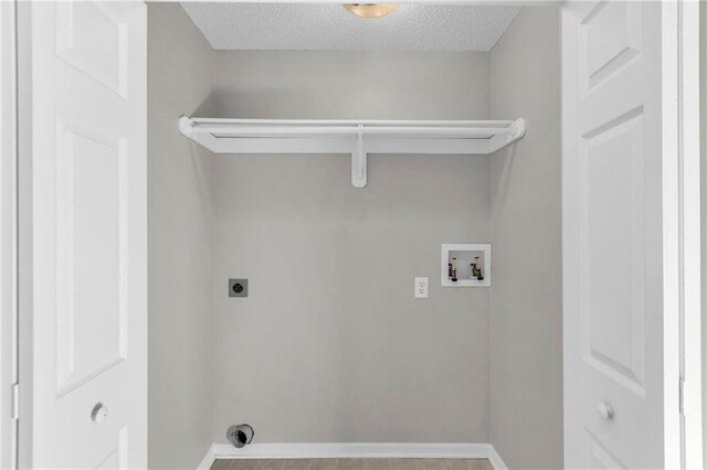 laundry room featuring light tile patterned floors, washer hookup, a textured ceiling, and hookup for an electric dryer