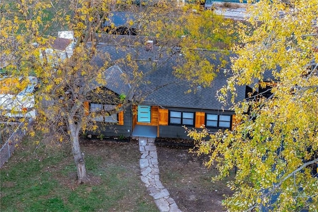 view of front of home featuring roof with shingles