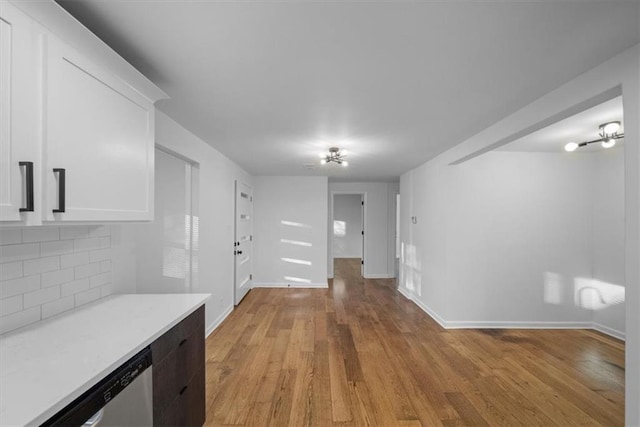 interior space with light wood finished floors and baseboards