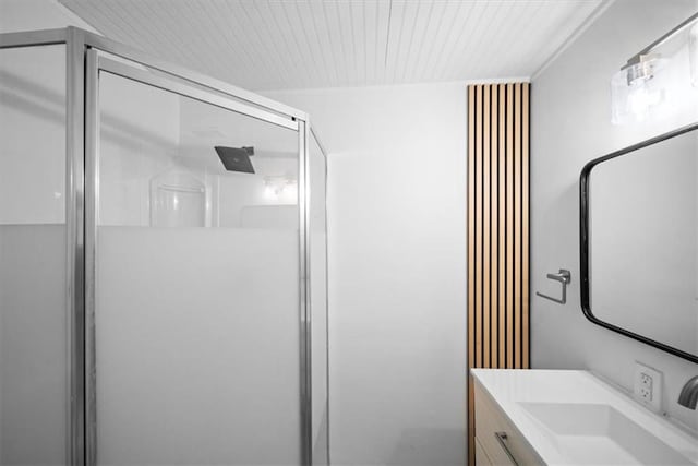 bathroom featuring a stall shower and vanity