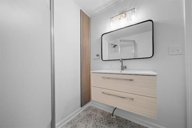 bathroom featuring vanity and baseboards