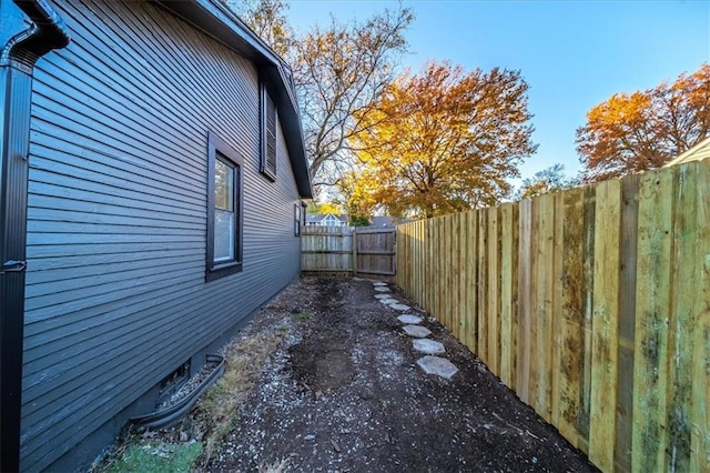 view of side of property featuring a fenced backyard