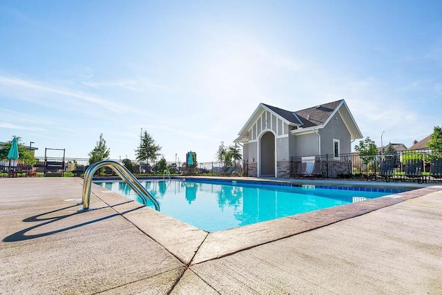 view of swimming pool with a patio