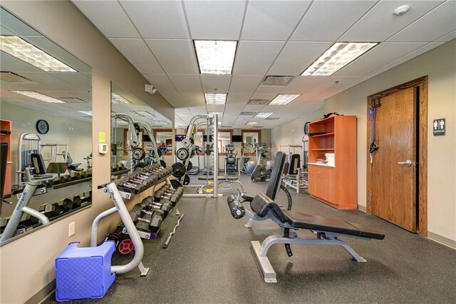 exercise room with a drop ceiling