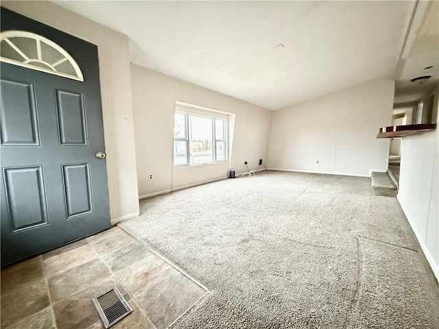 unfurnished living room with carpet flooring