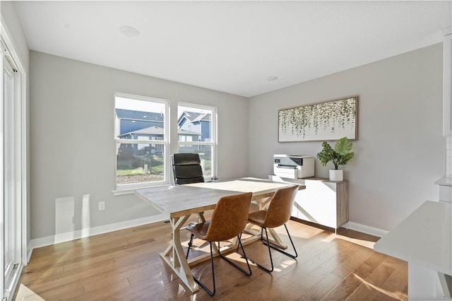 office area with light hardwood / wood-style floors