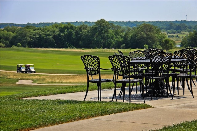 view of property's community with a yard