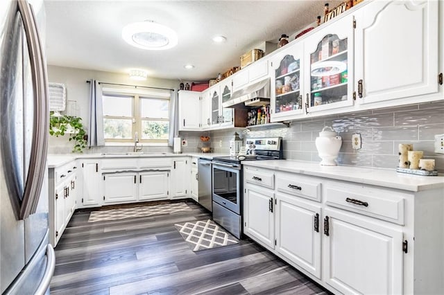 kitchen featuring white cabinets, dark hardwood / wood-style floors, and appliances with stainless steel finishes