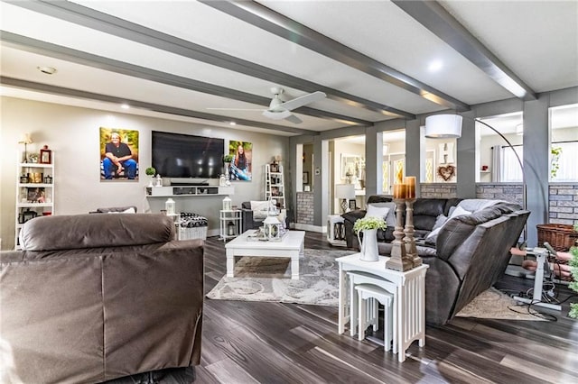 living room with beamed ceiling, ceiling fan, and dark wood-type flooring