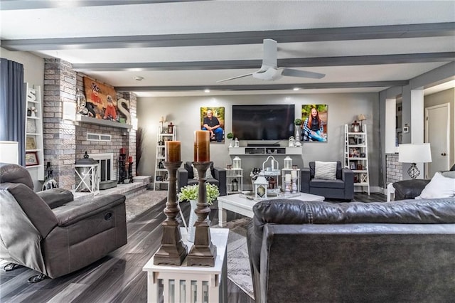 living room with beamed ceiling, ceiling fan, dark hardwood / wood-style flooring, and a fireplace