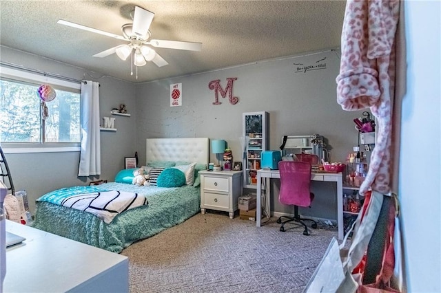 carpeted bedroom featuring ceiling fan and a textured ceiling