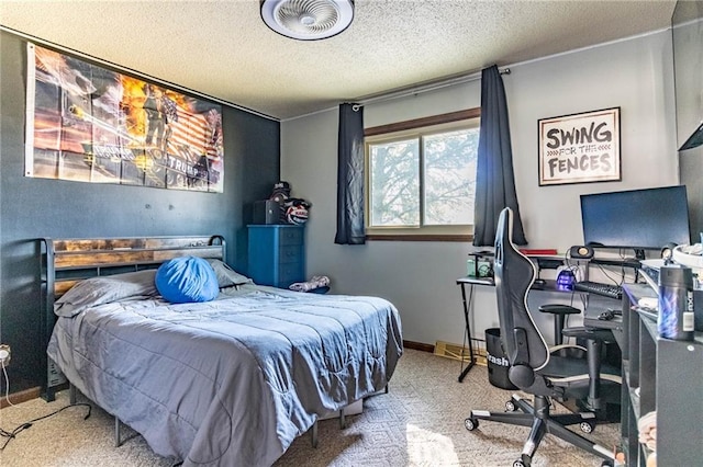 bedroom featuring carpet flooring and a textured ceiling