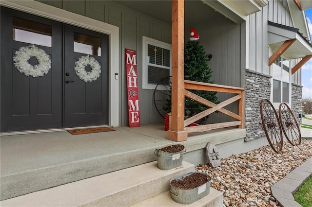 view of exterior entry featuring a porch