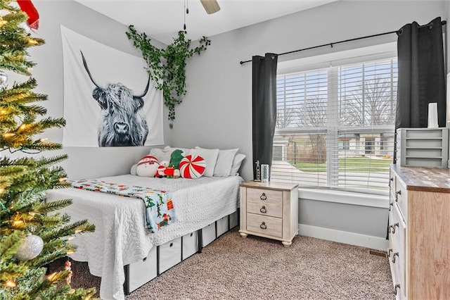 carpeted bedroom featuring ceiling fan