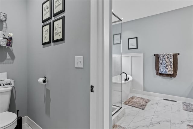 bathroom with shower with separate bathtub and toilet