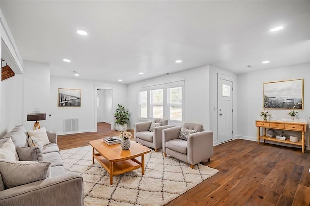 living room with light hardwood / wood-style flooring