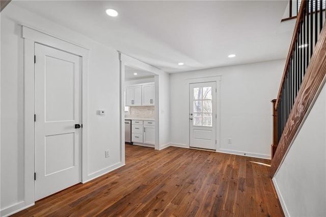 foyer entrance featuring dark wood-type flooring