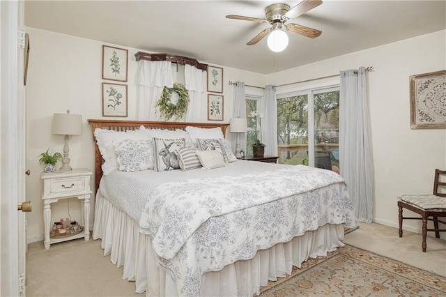 bedroom featuring ceiling fan, access to exterior, and light colored carpet