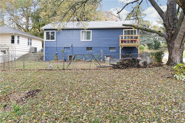 back of property featuring central AC unit